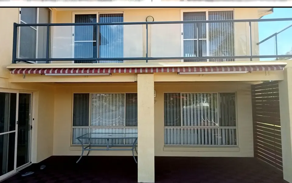 two-storey home after balcony repairs and a repaint