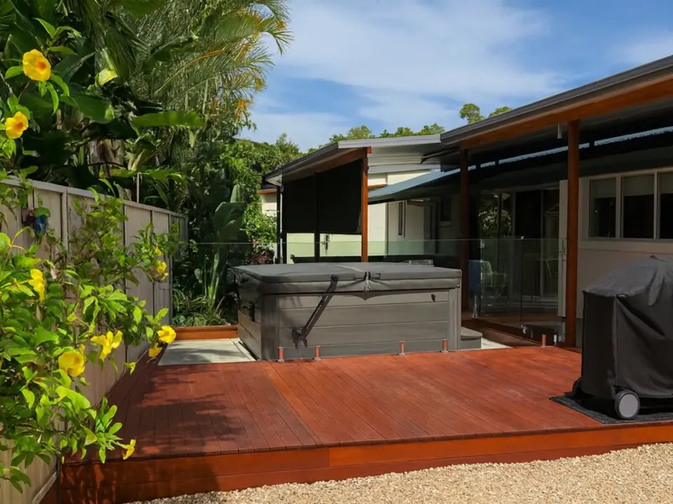 completed backyard deck with spa and pergola