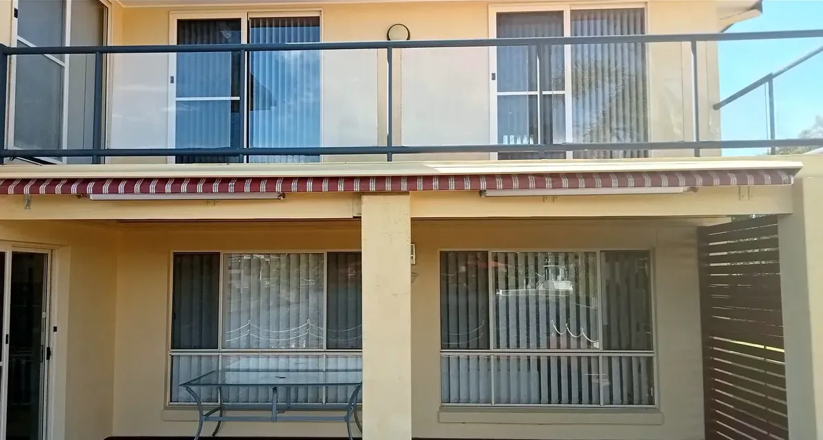 the rebuilt balcony with a new steel balustrade, awning and painted underside