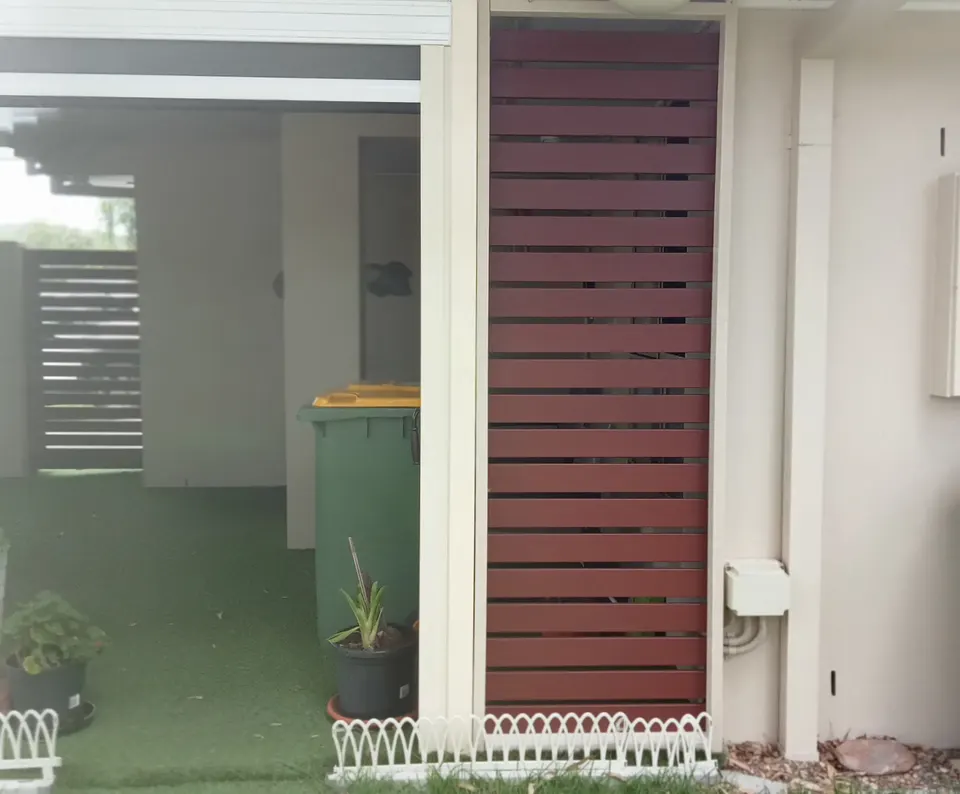 new timber slat infill panels fitted beside a garage
